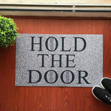 Tapis d'entrée drole hold the door