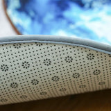 Le dessous de ce tapis rond ou on voit le caoutchouc dessous