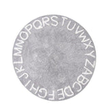 Gris est la couleur e ce tapis rond