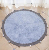 Tapis rond fait de coton avec des boules au bout