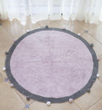 Tapis rose evec boulette autour