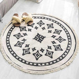 tapis rond aux motif géometrique noir