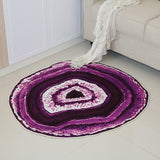 couleur mauve et centre blanc de ce tapis rond