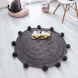 Tapis rond gris foncé