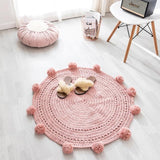 Rose est la chouette couleur de ce tapis rond