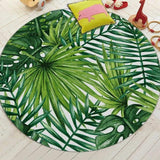 différente feuiles d'erbre sont representer sur ce tapis de salon rond