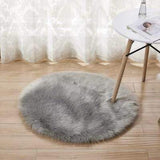 Petit tapis rond de salon de couleur gris