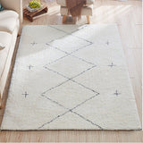 Tapis beige salon style kilim avec des motifs de croix et de carré