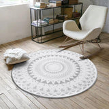Photos prises de ce tapis rond motif ethnique blanc