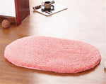 rose est la couleur de ce tapis de bain