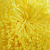 Poils jaune de ce tapis de bain
