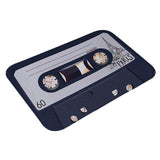 Petite cassette de video en joli tapis de salle de bain