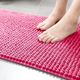 Rose clair et micro fibre sur ce tapis de bain