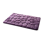tapis de salle de bain au motif design de galets violet 