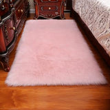 Couleur rose clair pour ce tapis de salon chaleureux
