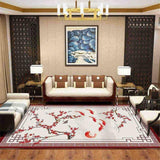 tapis de salon japonais, branches de cerisier et poissons rouge sur fond beige présenté dans salon tipyque